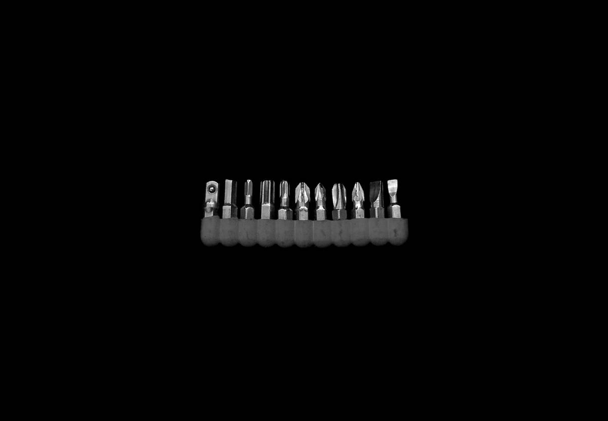 Drill bit types matched to materials: HSS for metal, brad point for wood, carbide for masonry, spear-point for tile